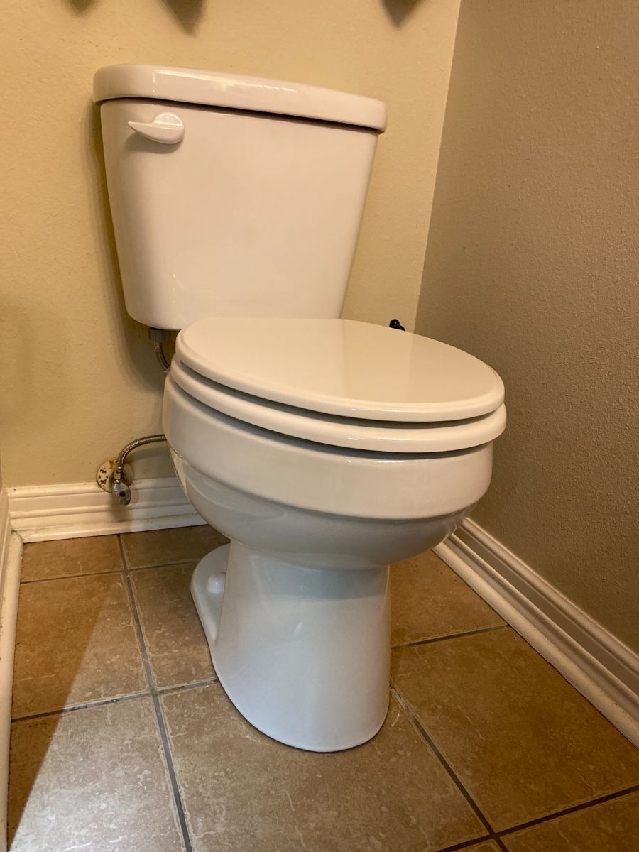 Newly installed toilet in a residential bathroom
